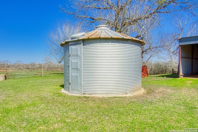 view of shed with fence