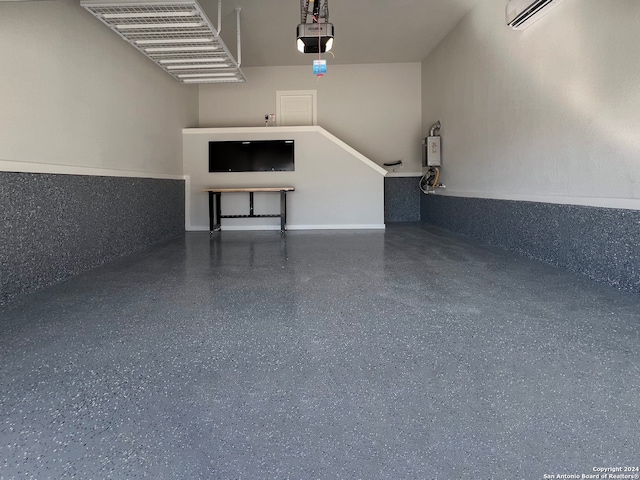 garage featuring an AC wall unit and a garage door opener