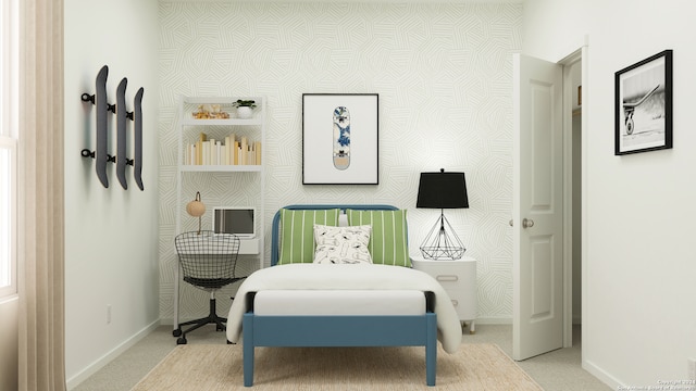 bedroom featuring wallpapered walls, an accent wall, baseboards, and carpet flooring