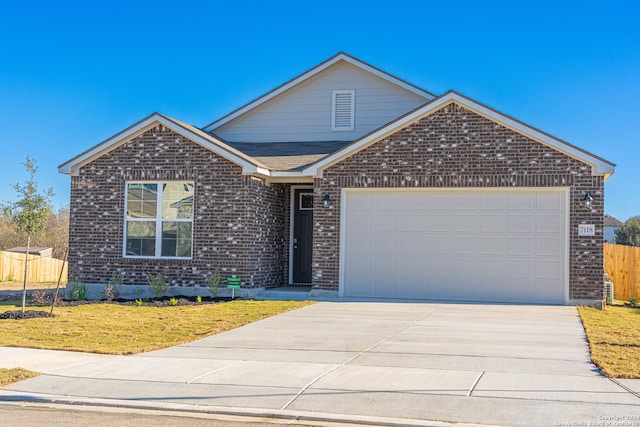 single story home with brick siding, concrete driveway, fence, a garage, and a front lawn