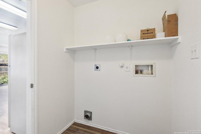 laundry room featuring washer hookup, gas dryer hookup, electric dryer hookup, wood finished floors, and laundry area