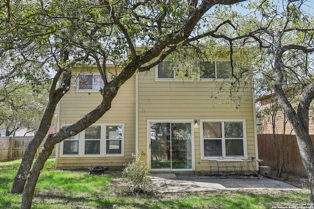 back of house featuring a patio area and fence