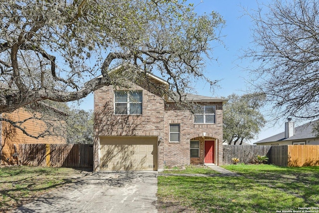 traditional home with brick siding, concrete driveway, an attached garage, fence, and a front lawn