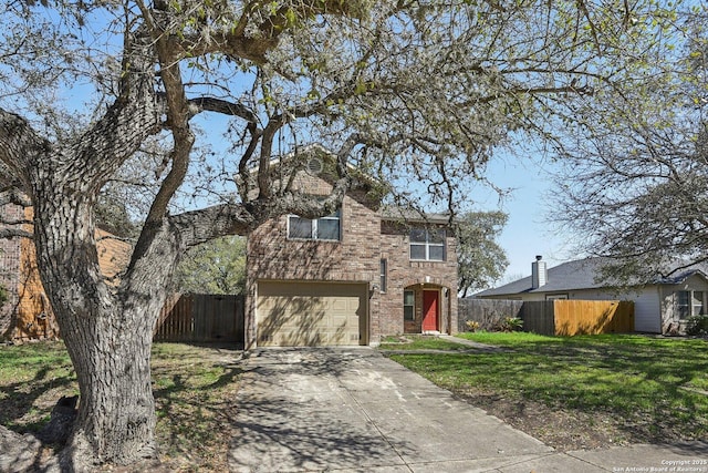 traditional-style house with an attached garage, brick siding, fence, concrete driveway, and a front lawn