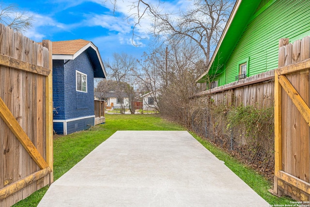 view of yard with a patio and fence