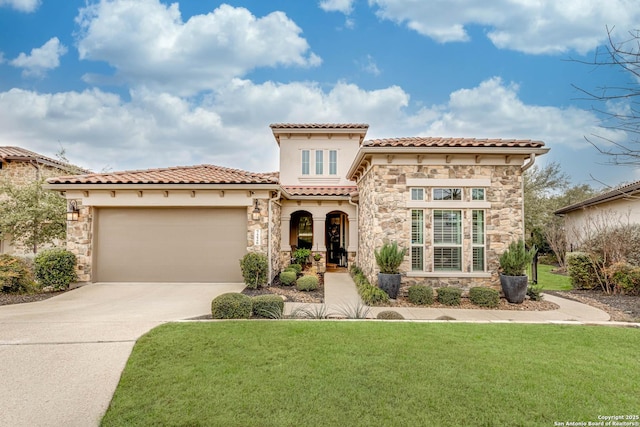 mediterranean / spanish-style home featuring a garage, a front yard, stone siding, and driveway