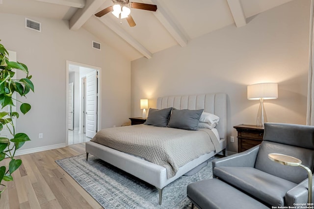 bedroom with vaulted ceiling with beams, light wood-style flooring, visible vents, and baseboards