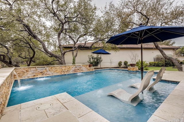 pool featuring a patio area