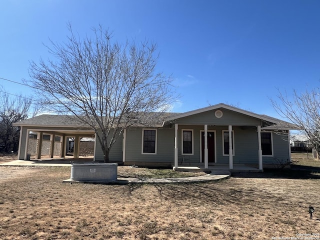 single story home featuring covered porch