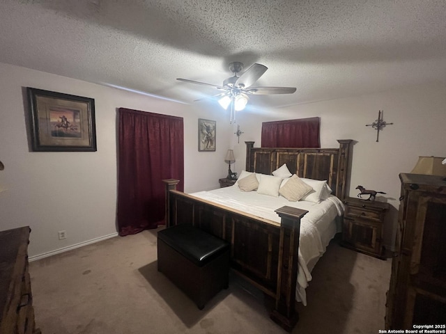 bedroom featuring light carpet, ceiling fan, a textured ceiling, and baseboards