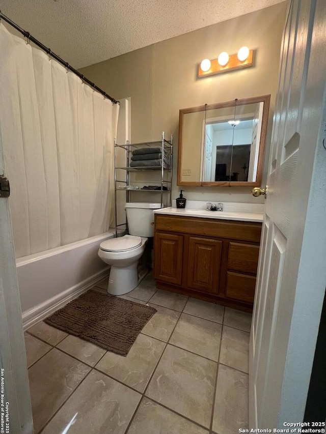 bathroom featuring a textured ceiling, tile patterned flooring, toilet, vanity, and shower / bath combo