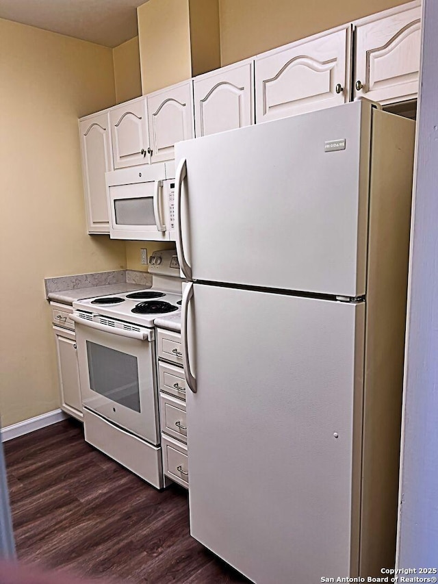 kitchen featuring white appliances, baseboards, dark wood-style flooring, light countertops, and white cabinetry