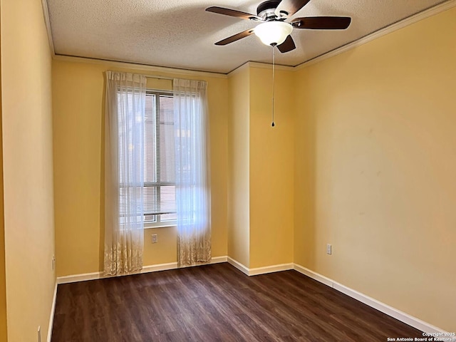 unfurnished room with ornamental molding, dark wood-style flooring, a textured ceiling, and baseboards