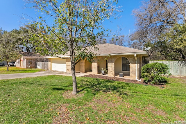 single story home with brick siding, concrete driveway, an attached garage, a front yard, and fence