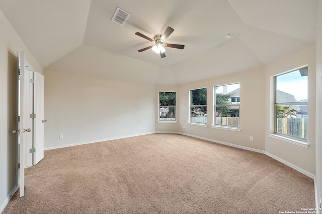 unfurnished room featuring baseboards, visible vents, a raised ceiling, a ceiling fan, and carpet floors