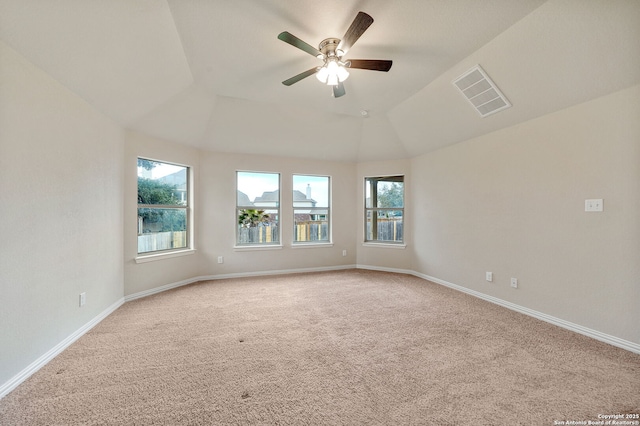 spare room with baseboards, carpet flooring, visible vents, and a healthy amount of sunlight