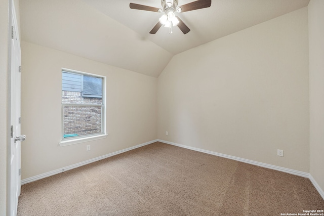 empty room featuring a ceiling fan, lofted ceiling, baseboards, and carpet