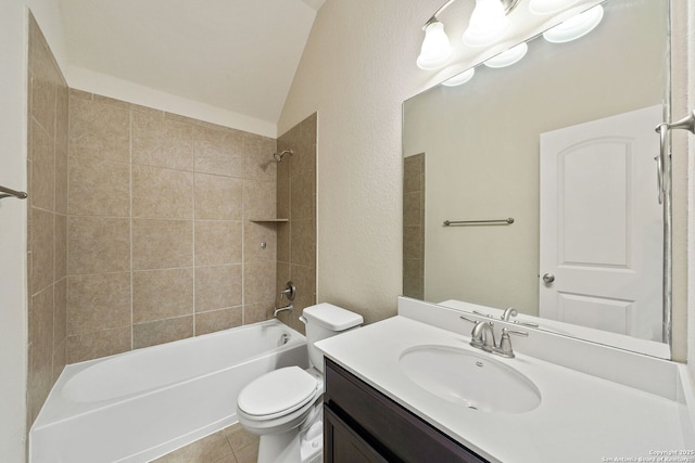 full bathroom with toilet, lofted ceiling,  shower combination, tile patterned flooring, and vanity