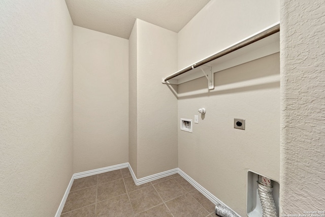 laundry area with washer hookup, hookup for a gas dryer, hookup for an electric dryer, laundry area, and tile patterned floors