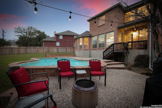 view of swimming pool with a patio, fence private yard, and a fenced in pool