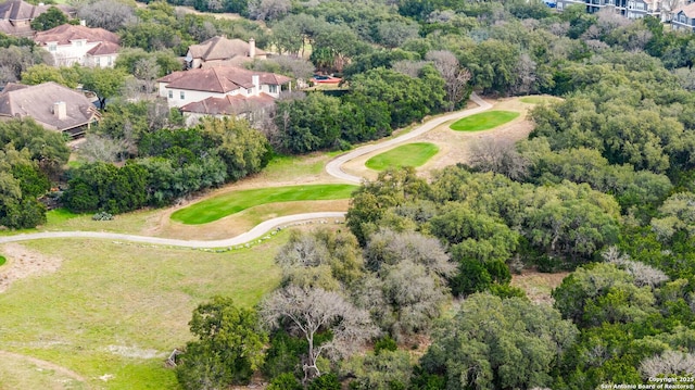 aerial view featuring a wooded view