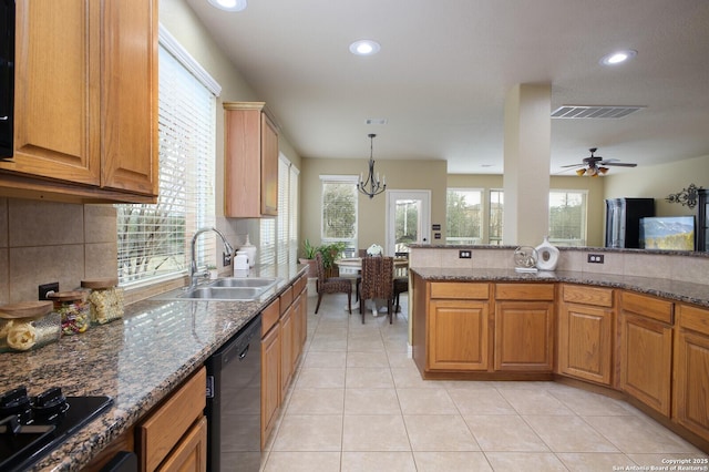 kitchen with black appliances, light tile patterned floors, decorative backsplash, and a sink