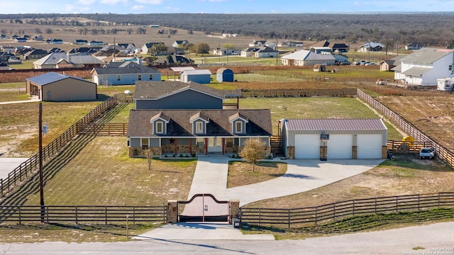 drone / aerial view featuring a rural view and a residential view