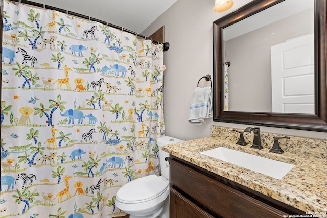 full bathroom with toilet, vanity, and a shower with curtain