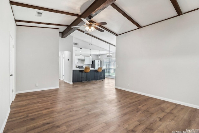 unfurnished living room with ceiling fan with notable chandelier, wood finished floors, visible vents, and vaulted ceiling with beams