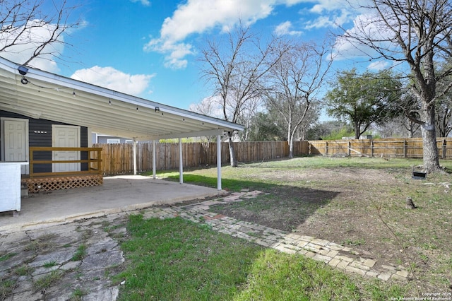 view of yard featuring a patio area and a fenced backyard