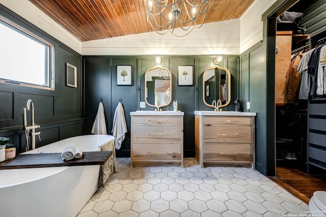 full bathroom with wood ceiling, vaulted ceiling, vanity, and an inviting chandelier