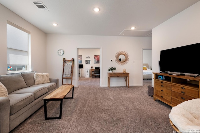 carpeted living area featuring attic access, visible vents, baseboards, and recessed lighting