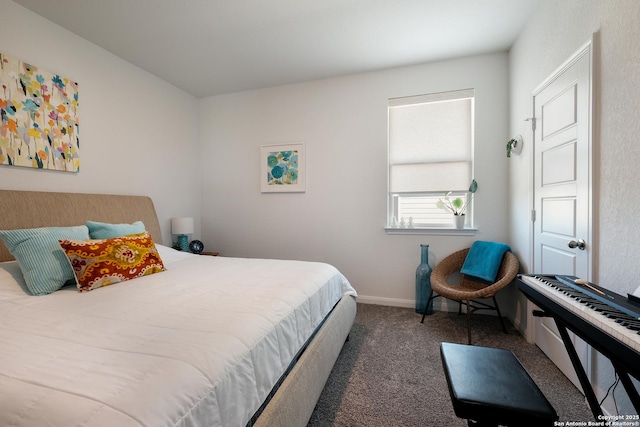 carpeted bedroom featuring baseboards