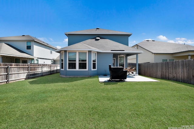 back of house featuring a patio area, a fenced backyard, a lawn, and roof with shingles