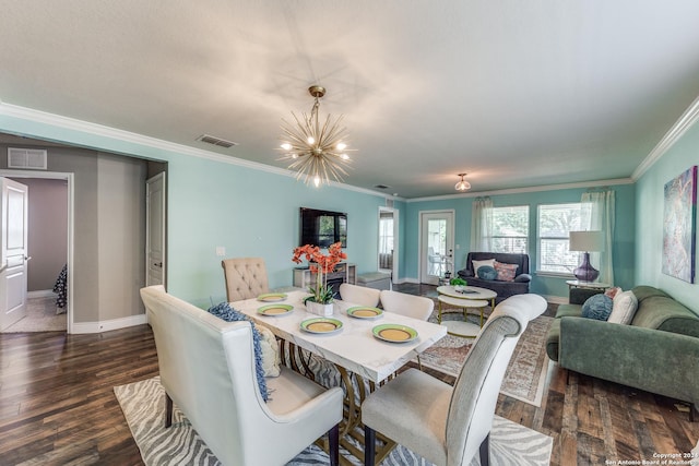 dining room with dark wood-style floors, crown molding, visible vents, and baseboards