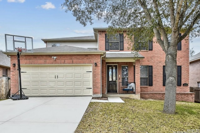 traditional-style home featuring an attached garage, driveway, brick siding, and a front yard