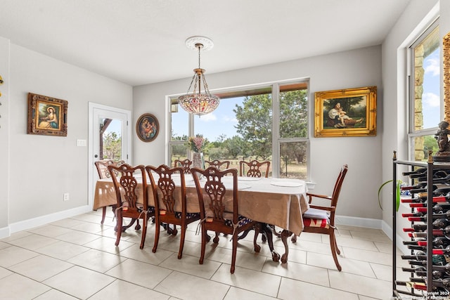 dining room with baseboards, a wealth of natural light, and light tile patterned flooring