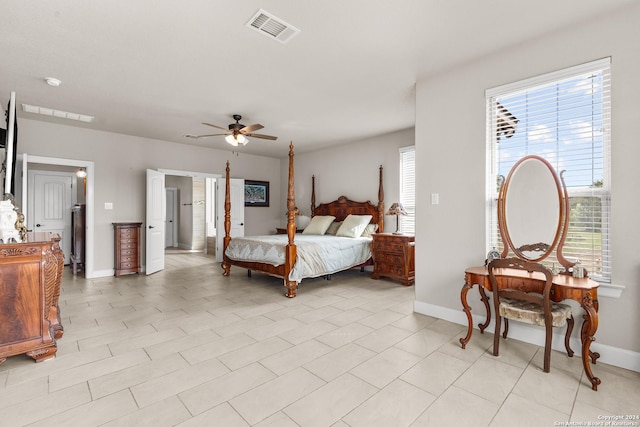 bedroom with visible vents, ceiling fan, baseboards, and light tile patterned floors