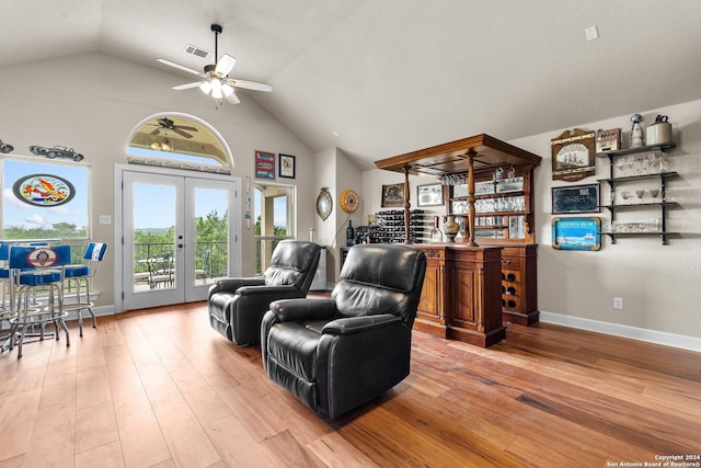 living room with light wood-type flooring, baseboards, visible vents, and french doors