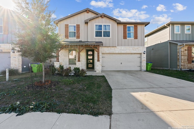 view of front of home featuring a garage, stone siding, board and batten siding, and concrete driveway