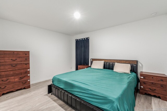 9211 Navarro Vis, Seguin, TX 78155 - bedroom with light wood-style flooring and baseboards