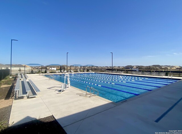 9211 Navarro Vis, Seguin, TX 78155 - community pool with fence and a patio