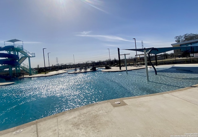 9211 Navarro Vis, Seguin, TX 78155 - view of swimming pool with playground community