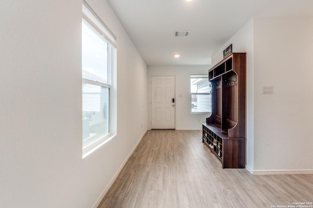 9211 Navarro Vis, Seguin, TX 78155 - mudroom featuring baseboards, visible vents, and wood finished floors