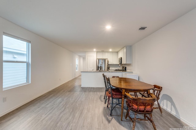 9211 Navarro Vis, Seguin, TX 78155 - dining area featuring a wealth of natural light, visible vents, light wood-style flooring, and recessed lighting