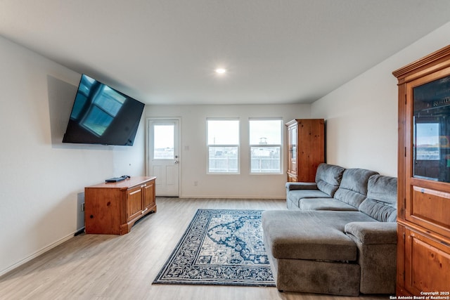 9211 Navarro Vis, Seguin, TX 78155 - living room with baseboards and light wood finished floors