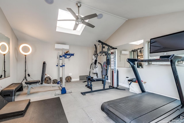 exercise room featuring baseboards, vaulted ceiling with skylight, a ceiling fan, and an AC wall unit