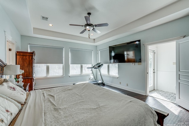 bedroom with recessed lighting, wood finished floors, a ceiling fan, visible vents, and a raised ceiling