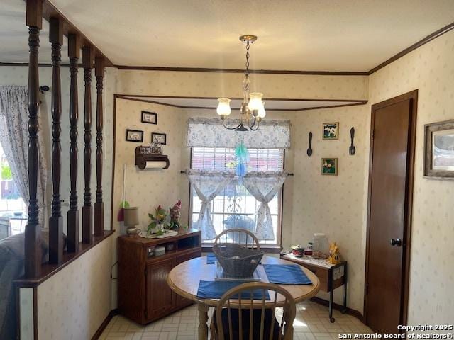 dining area with a chandelier, light floors, ornamental molding, and wallpapered walls