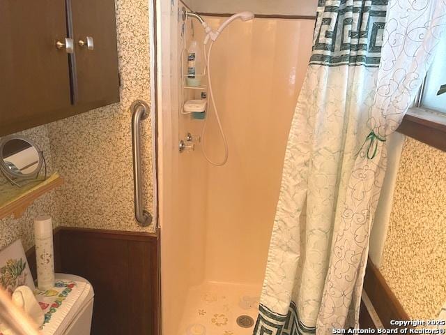 bathroom with a shower stall